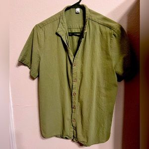 Olive green button-up shirt.